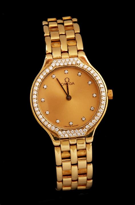 omega 18k gold ladies watch.